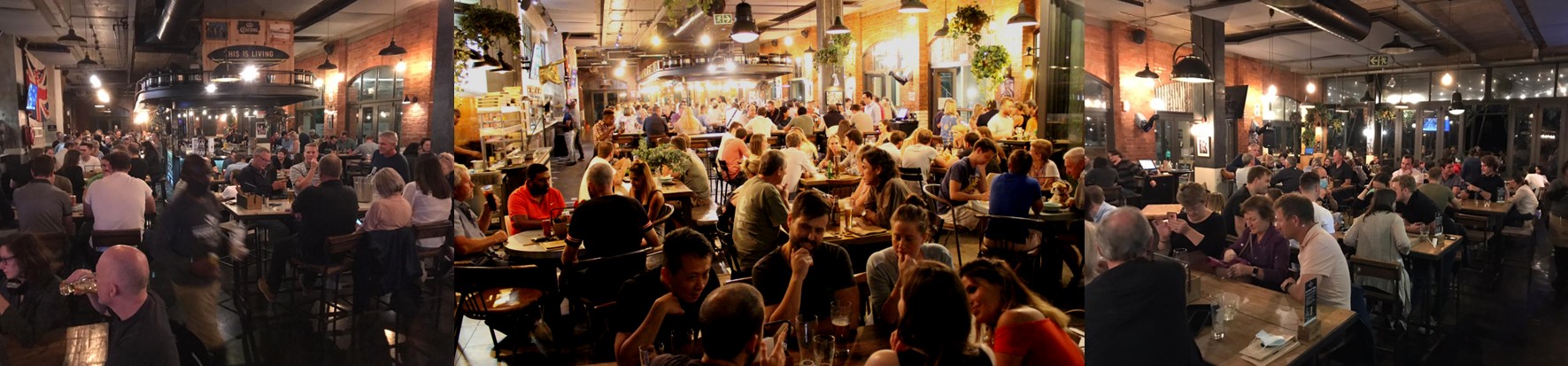 People in a full pub enjoying a quiz